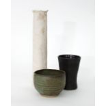A tall cylindrical porcelain vase, impressed with leaf decoration, 26cm high,