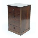 A Victorian set of mahogany drawers fitted four drawers with turned handles