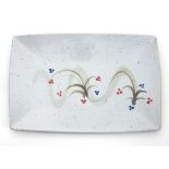 Russell Collins/A rectangular dish with red and blue brush decoration on a white ground,