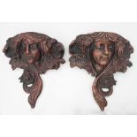 A pair of Art Nouveau terracotta figural wall pockets,