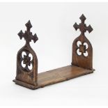 A Victorian oak book carrier, with cruciform finials and pierced ends,