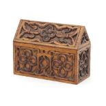 A Victorian gothic oak stationery box carved quatrefoils, fleurs-de-lis and with fitted interior,