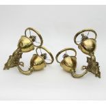 Two brass wall oil lamps with dolphin supports