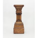 A Victorian gothic oak pedestal with square canted top,