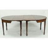 A George III mahogany D-end dining table with two leaves,