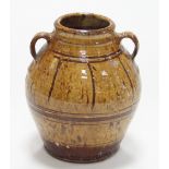 Winchcombe Pottery/An earthenware jar with slip decoration, twin handles and impressed seal to base,