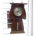 Liberty [retailer]/An Art Nouveau oak cased barometer,