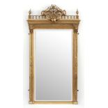 A giltwood wall mirror of Empire design,