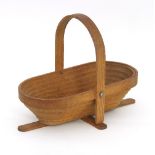 An American shaker style collapsible wooden trug, with hoop handle, folding completely flat,