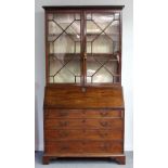 A George III mahogany bureau bookcase,