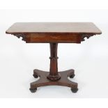 A Regency rosewood side table, fitted a single drawer on a fluted column and platform base,