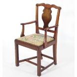 A late 19th /early 20th Century child's mahogany armchair with single shaped back splat on square