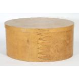 A large wooden Shaker box/ottoman of traditional oval form,