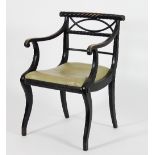 A Regency ebonised open armchair,