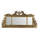 A George III style rococo carved and gilded three-part landscape mirror,