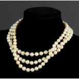 A cultured pearl three-row necklace with a split pearl and blue enamel clasp