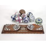 A part set of ceramic carpet bowls comprising seven ceramic balls,