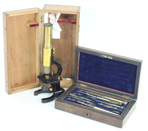 A student's microscope, 24ch high, in a fitted case,