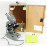 An Olympus KHC electric biological microscope, 38cm high,