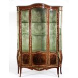 A 19th Century French kingwood glazed serpentine vitrine,