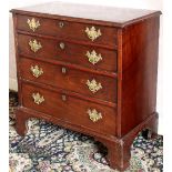 A George III mahogany chest with four graduated drawers on shaped bracket feet and brass swing