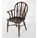 A yew wood pierced and draught back Prior chair with solid seat in elm on turned legs with