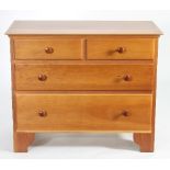 A Shaker cherry wood small chest of drawers of two short and two long on bracket feet,