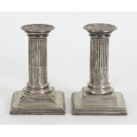 A pair of dwarf silver candlesticks, HE Ltd, Sheffield,