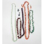 A strand of faceted agate beads and the matching ear pendants,