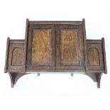 A 19th Century walnut veneered breakfront wall cabinet,