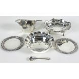 A silver cigarette tray, London 1953, a silver sauce boat, 1899, a silver bon bon dish,