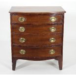 A Regency mahogany bowfront chest of four long graduated drawers with oval swing handles on bracket