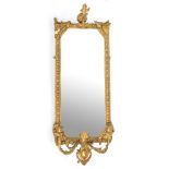 An early 19th Century giltwood girandole, with canted rectangular mirror,