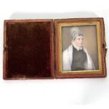 A 19th Century English portrait miniature depicting a lady in a lace cap, watercolour on ivory, 8.