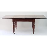 A William IV mahogany withdraw library table in the manner of Gillows,