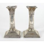 A pair of late Victorian silver candlesticks, Sheffield 1893, of Corinthian column form,