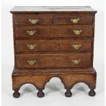 An 18th Century fruitwood chest on stand fitted two short and three long drawers,