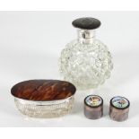An Edwardian silver mounted scent bottle with tortoiseshell and silver inlaid cover,