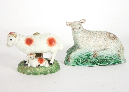 A Staffordshire pearlware model of a recumbent sheep, circa 1780, and another of a ewe and lamb,