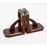 A pair of Arts and Crafts style carved bookends, each of pierced buttress form,