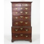 A 19th Century oak chest on chest, the top section fitted two short and four long drawers,