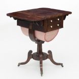 A Regency rosewood work table with two flaps and two drawers, with wool basket beneath,