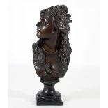 A bronze bust of a young woman, signed 'Saibas', looking to her right, on a plinth base,