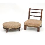 A Victorian walnut oval footstool with upholstered top on scroll feet,