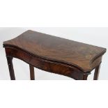 A George II mahogany serpentine card table on square moulded and chamfered legs,