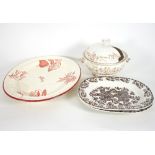 A Wedgwood creamware meat platter decorated with transfer printed flower specimens in rust red,