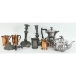 A half-ribbed teapot and matching hot water jug, three copper mugs,