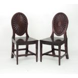A pair of George III mahogany hall chairs, in the manner of Mayhew & Ince,
