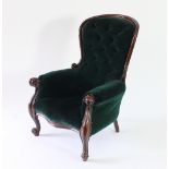 A 19th Century mahogany framed button back armchair with scrolling cabriole legs and deep green