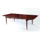 A 19th Century mahogany extending dining table,